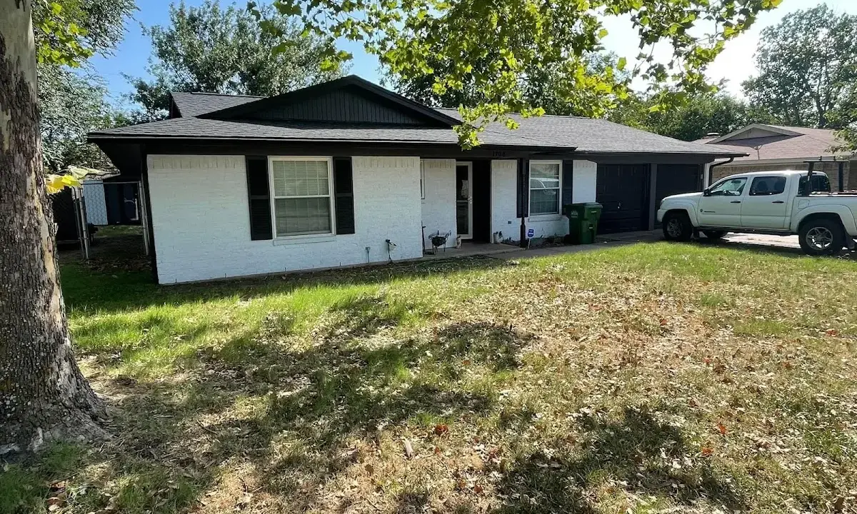 Professional roofing crew working on a residential roof in New Hanover